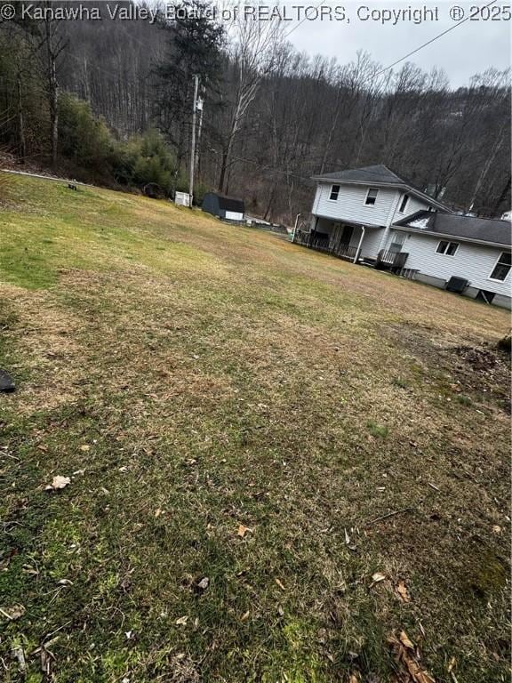 81 Amburgey Ln, Amherstdale, WV 25607 - view of yard with a wooded view