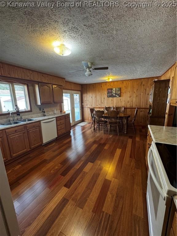 81 Amburgey Ln, Amherstdale, WV 25607 - kitchen featuring a sink, dark wood-style floors, light countertops, white appliances, and brown cabinetry