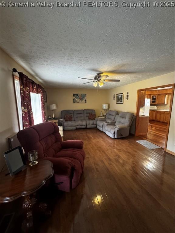 81 Amburgey Ln, Amherstdale, WV 25607 - living area with a textured ceiling, ceiling fan, and wood finished floors