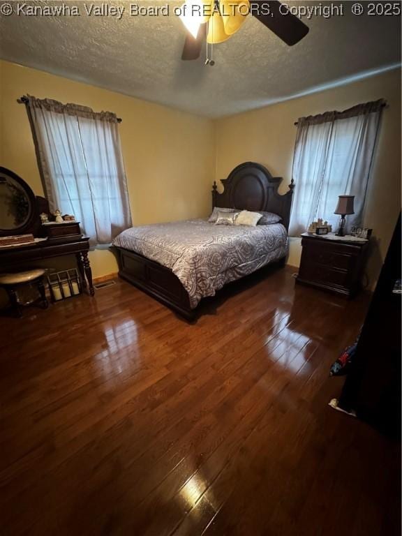 81 Amburgey Ln, Amherstdale, WV 25607 - bedroom featuring dark wood finished floors, a textured ceiling, and ceiling fan