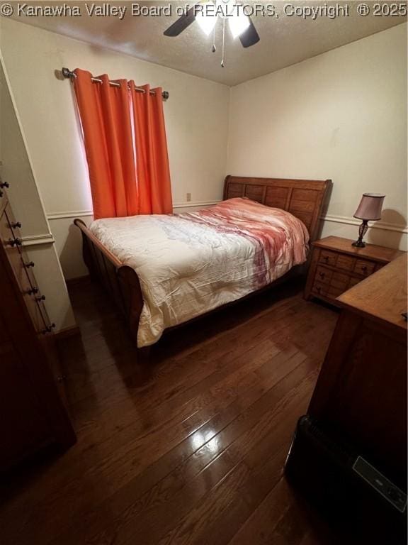 81 Amburgey Ln, Amherstdale, WV 25607 - bedroom with ceiling fan, a textured ceiling, and dark wood-style floors