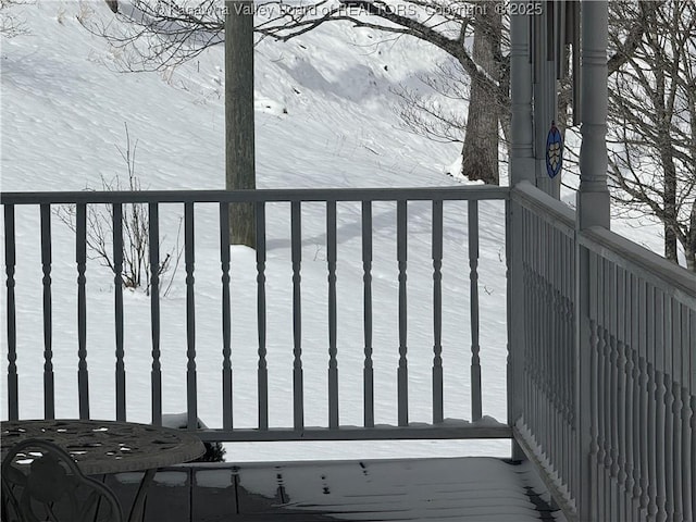 view of snow covered deck