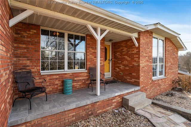 entrance to property with brick siding