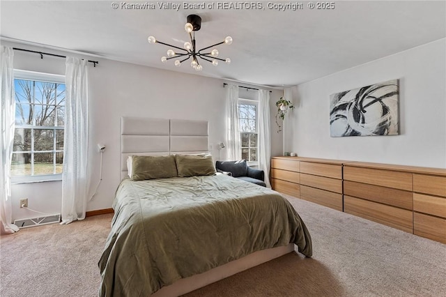 bedroom with carpet floors, an inviting chandelier, baseboards, and visible vents