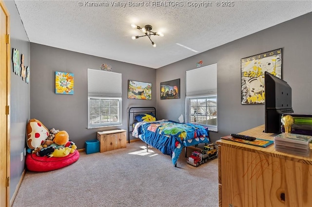 carpeted bedroom with a textured ceiling