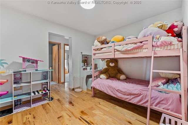 bedroom with wood finished floors