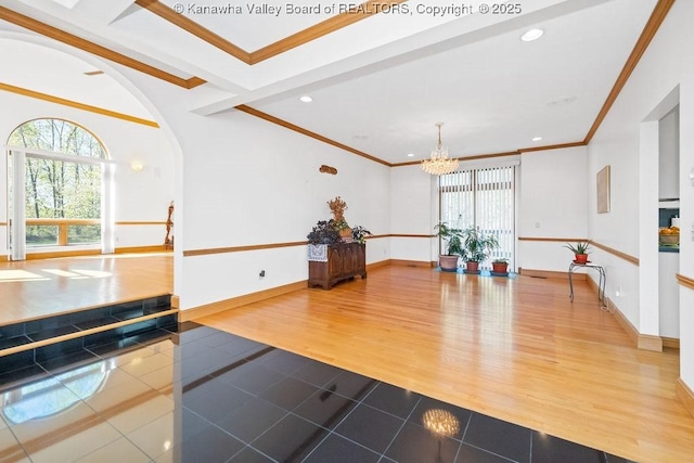 workout room featuring a chandelier, recessed lighting, wood finished floors, baseboards, and ornamental molding