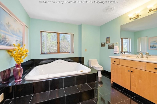 bathroom featuring tile patterned floors, visible vents, toilet, vanity, and a bath