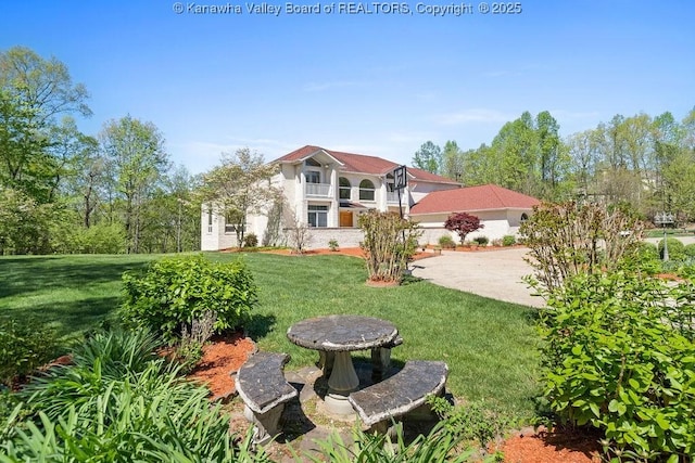 exterior space featuring a patio area and a lawn