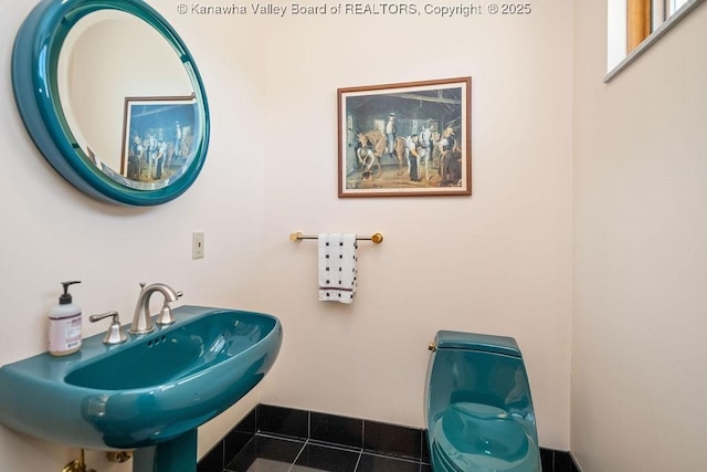 bathroom with a sink and tile patterned floors