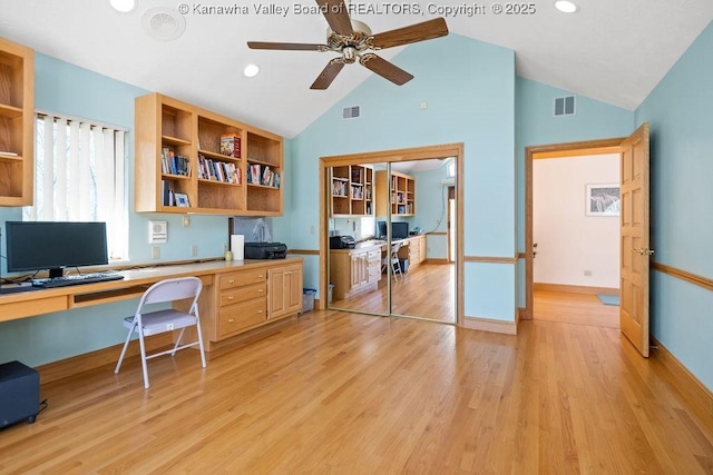 office space featuring built in desk, light wood-type flooring, visible vents, and baseboards