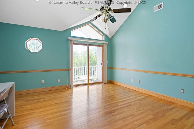 interior space featuring light wood-style flooring, vaulted ceiling, baseboards, and ceiling fan