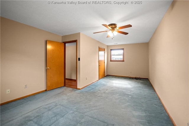 unfurnished room featuring light colored carpet, ceiling fan, and baseboards