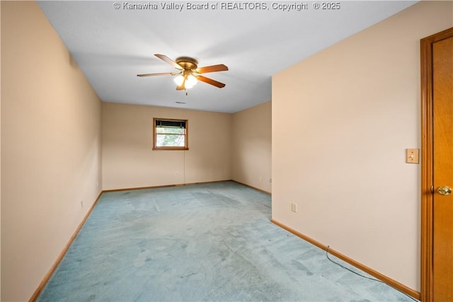 unfurnished room with light carpet, baseboards, and a ceiling fan