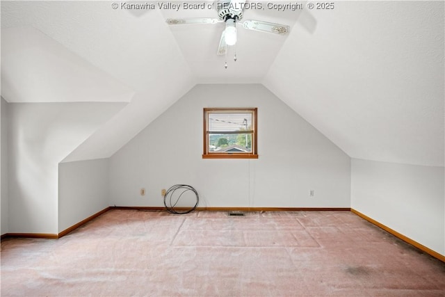 additional living space with lofted ceiling, ceiling fan, carpet flooring, and baseboards