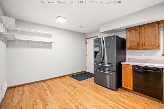 kitchen with light wood finished floors, light countertops, brown cabinetry, fridge with ice dispenser, and dishwasher