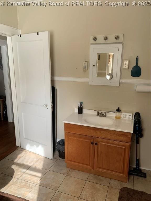 bathroom featuring tile patterned floors and vanity