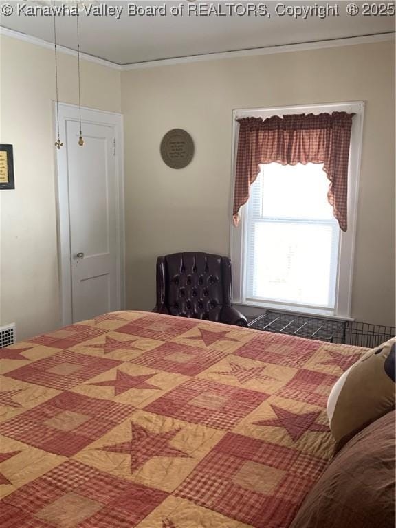 bedroom featuring crown molding