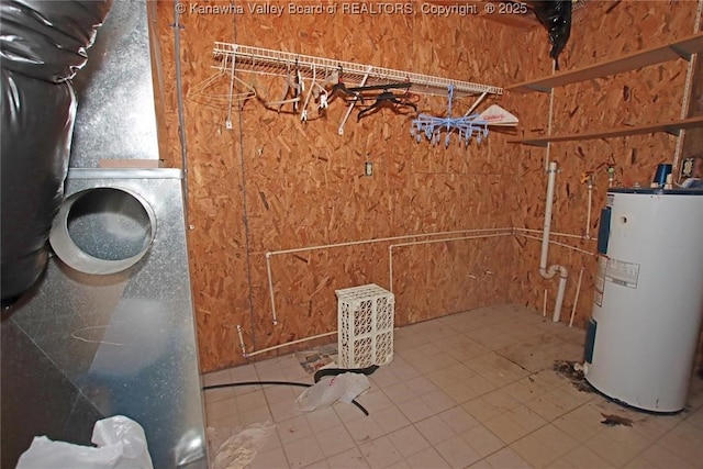 utility room featuring electric water heater