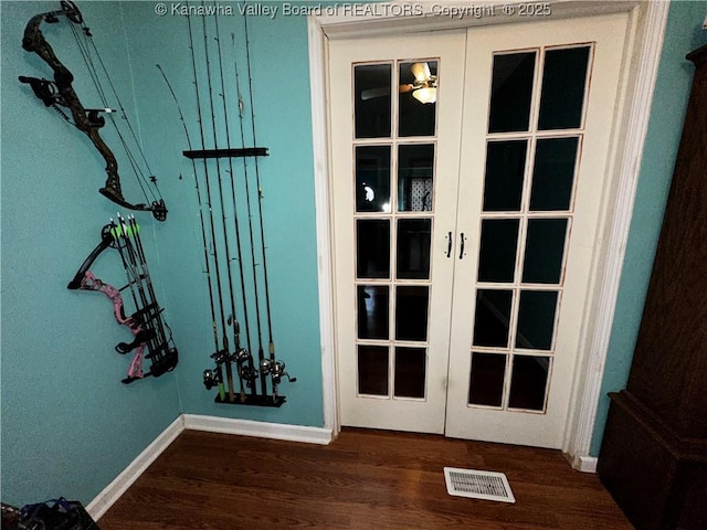 entryway featuring dark wood-style floors, french doors, visible vents, and baseboards