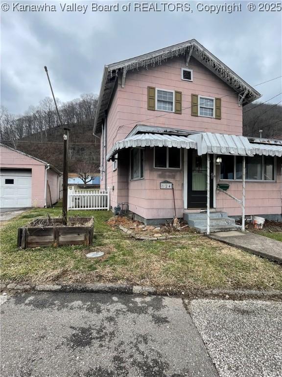 view of front of home with an outbuilding