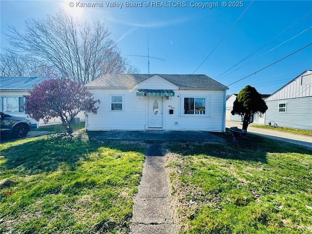 bungalow-style house featuring a front yard