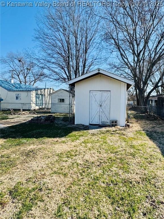 view of shed with fence