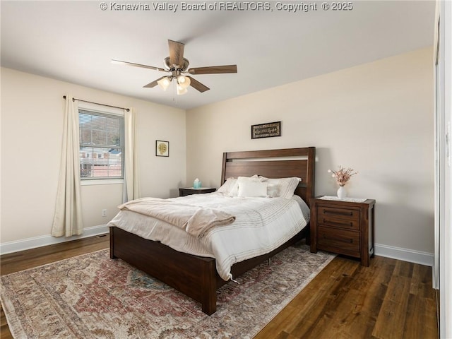 bedroom with dark wood-style floors, ceiling fan, and baseboards