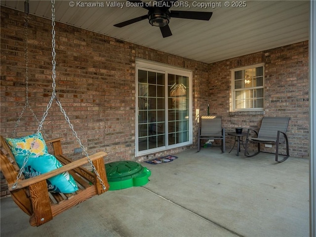 view of patio featuring a ceiling fan