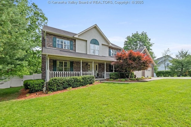 view of front of home featuring a garage, covered porch, fence, a front yard, and brick siding