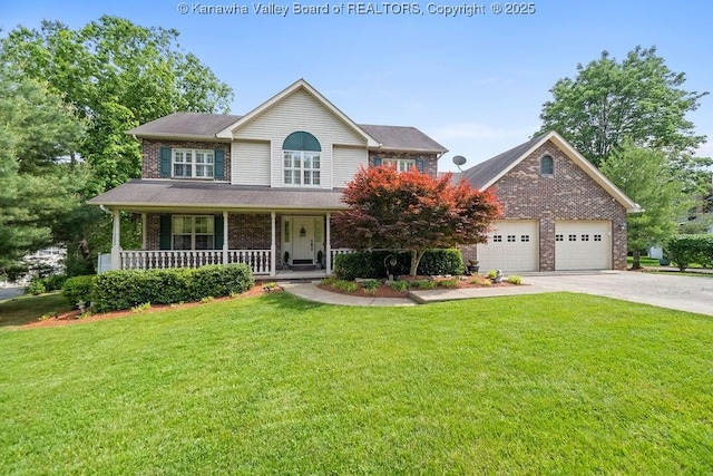 colonial home with a porch, a front yard, driveway, and an attached garage