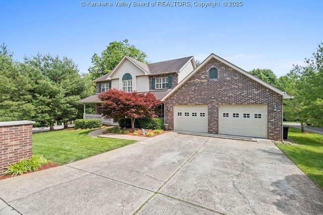 view of front of home featuring a front yard, brick siding, driveway, and an attached garage