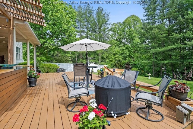 wooden deck with outdoor dining space