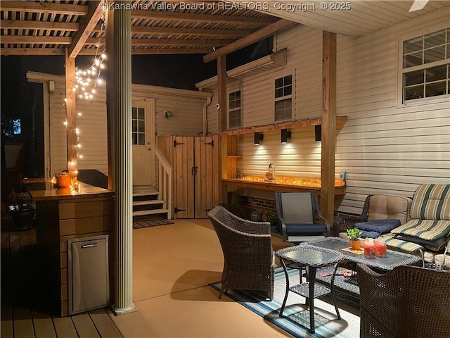 view of patio featuring a pergola and outdoor dining space