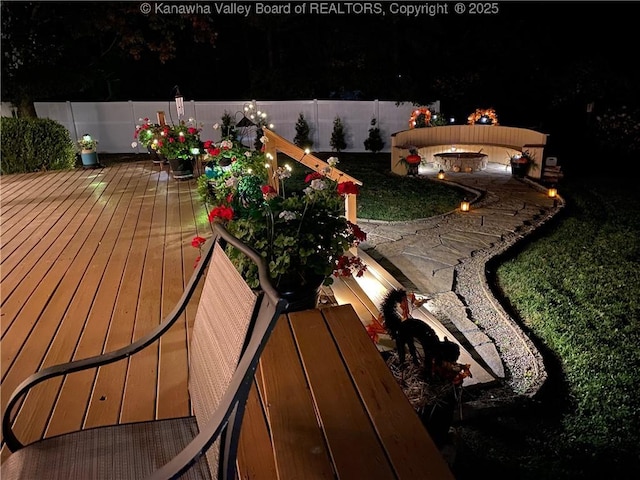 view of wooden balcony with a fire pit and a deck