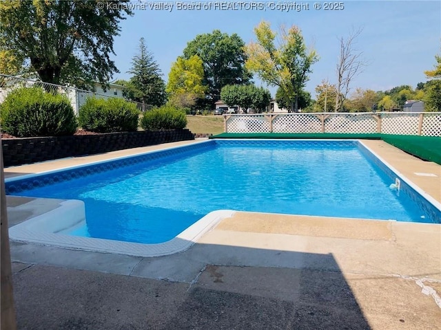 view of swimming pool featuring a fenced backyard and a fenced in pool