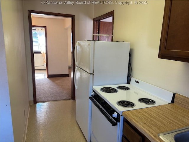 kitchen with white electric range oven, baseboards, a baseboard radiator, light countertops, and dark brown cabinets