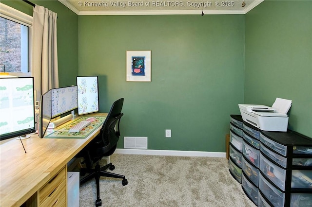 office space with baseboards, carpet, visible vents, and crown molding