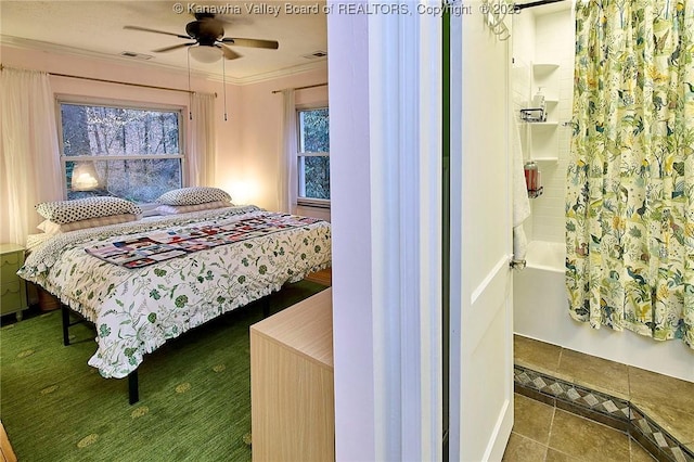 bedroom with visible vents, crown molding, and multiple windows