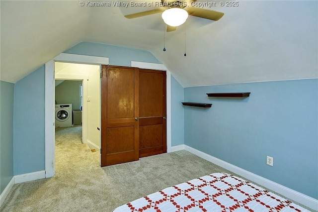 additional living space with lofted ceiling, a ceiling fan, baseboards, washer / clothes dryer, and carpet