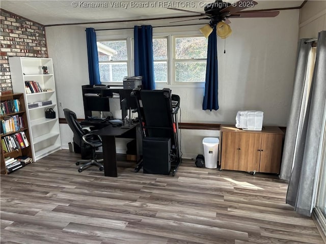 home office featuring a ceiling fan and wood finished floors