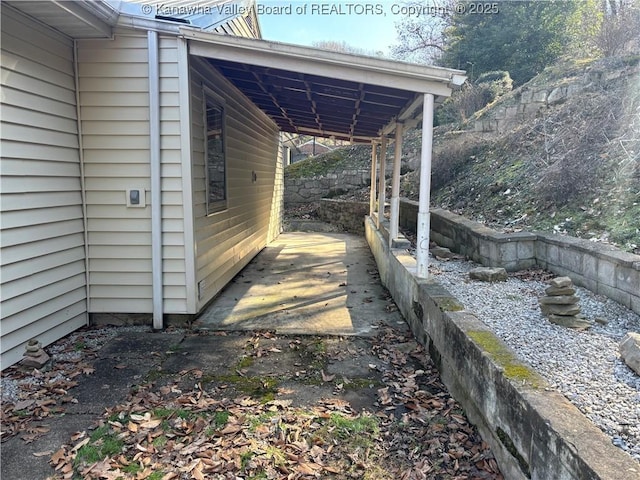 exterior space with a carport