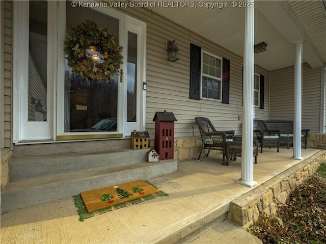 property entrance featuring covered porch