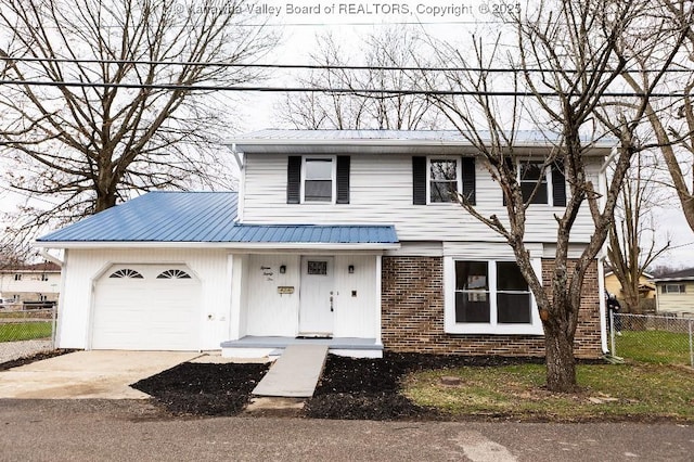 view of front of home with metal roof, a garage, brick siding, fence, and concrete driveway