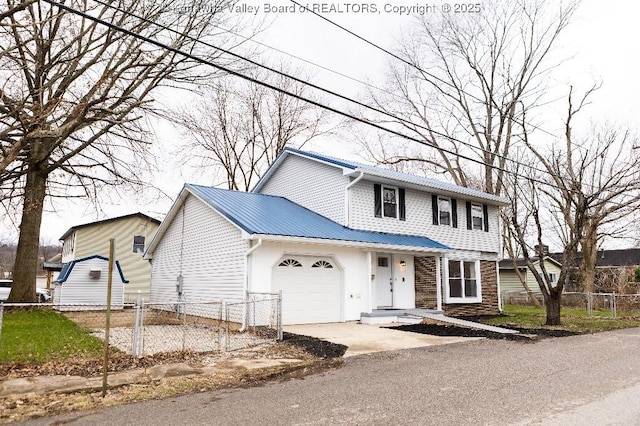 view of front of property with a garage, metal roof, fence, and concrete driveway