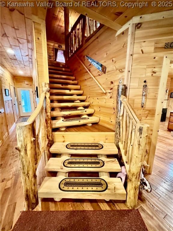 2299 Striker Fork Rd, Chapmanville, WV 25508 - stairway with wood walls, hardwood / wood-style flooring, and wood ceiling