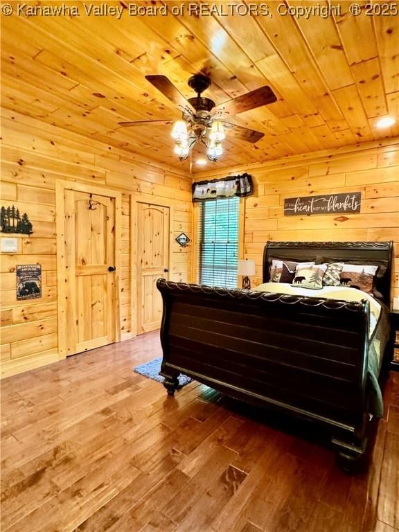 2299 Striker Fork Rd, Chapmanville, WV 25508 - bedroom featuring wood ceiling, wood walls, and hardwood / wood-style floors