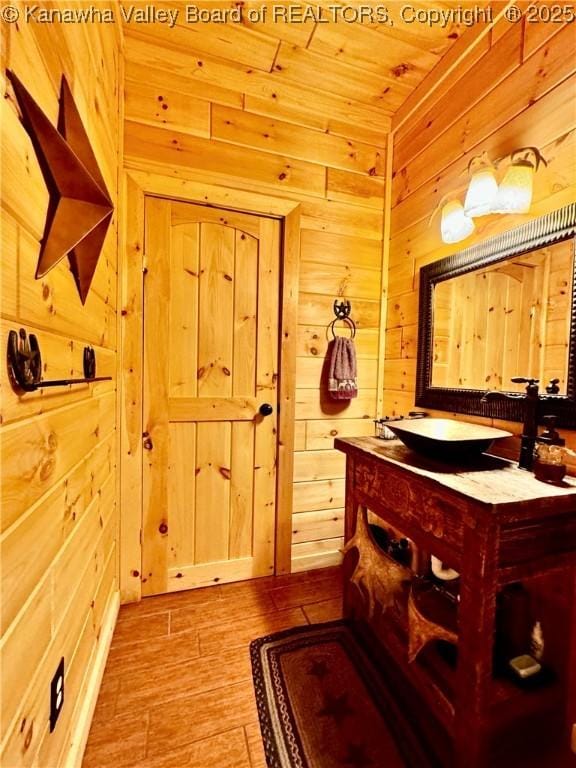 2299 Striker Fork Rd, Chapmanville, WV 25508 - bathroom with wooden walls, wood finished floors, vanity, and wood ceiling