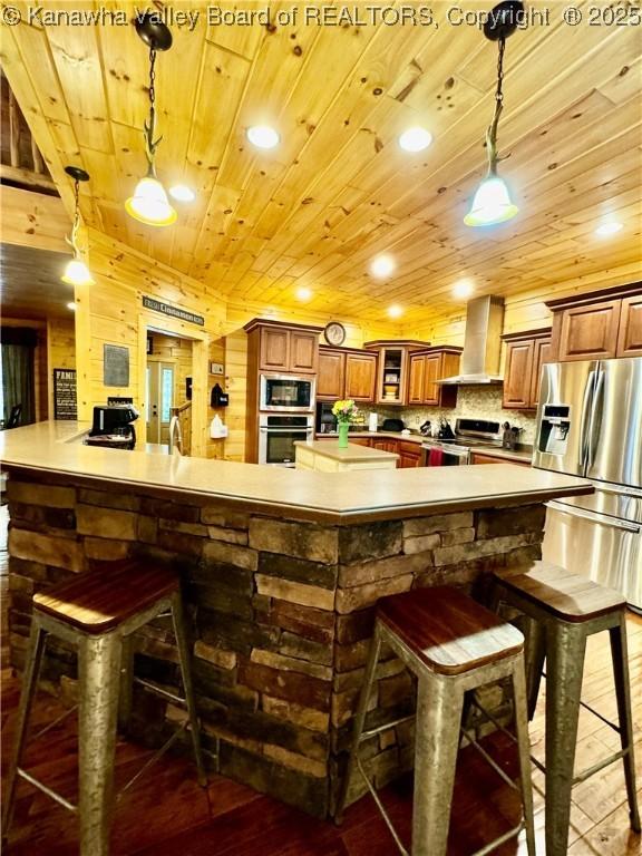 2299 Striker Fork Rd, Chapmanville, WV 25508 - kitchen with appliances with stainless steel finishes, a breakfast bar, hardwood / wood-style flooring, and wood ceiling