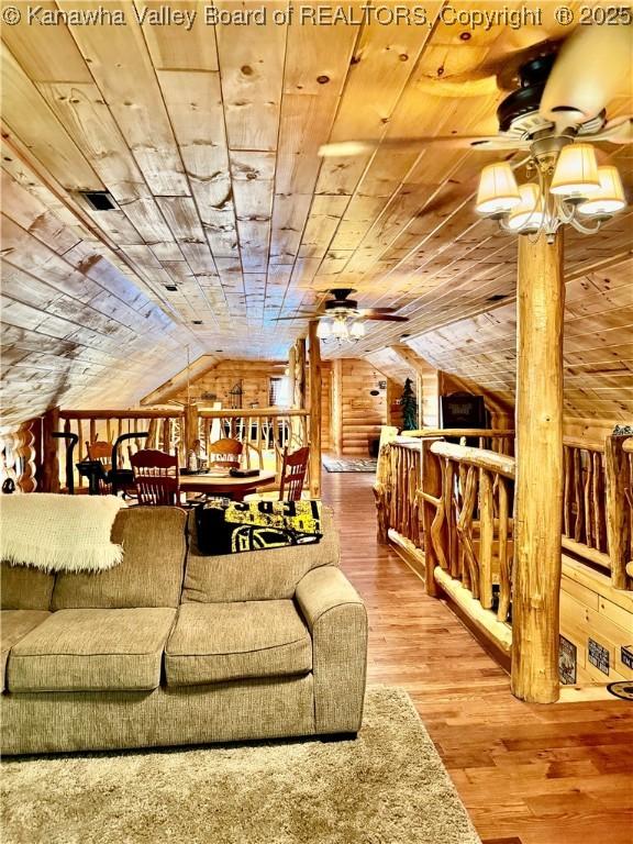 2299 Striker Fork Rd, Chapmanville, WV 25508 - living room featuring wood walls, wooden ceiling, vaulted ceiling, wood finished floors, and a ceiling fan